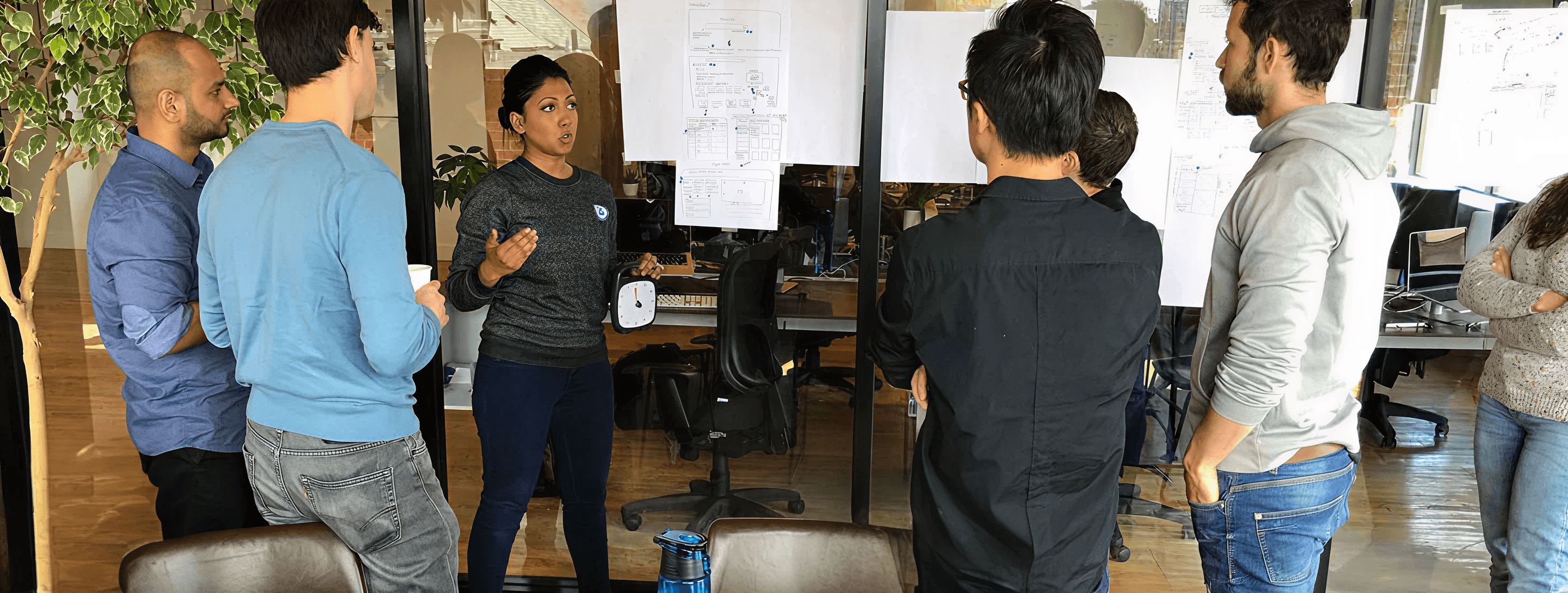 BenchSci team members in conversation at the office.
